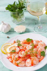 boiled shrimps on wooden surface