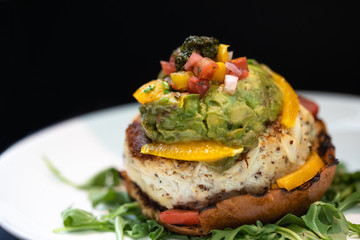 Chicken Sandwich Decorated with Orange bell peppers, Tomatoes, Guacamole and Pesto