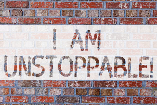 Handwriting text writing I Am Unstoppable. Concept meaning incapable of being stopped or destroyed encouraging speech Brick Wall art like Graffiti motivational call written on the wall