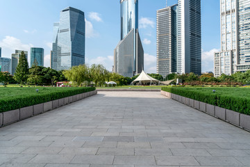 Empty square floor tiles and skyline of modern urban buildings in Shanghai..