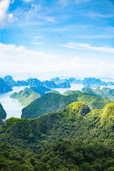 scenic view over Ha Long bay from Cat Ba island, Ha Long city in the background, UNESCO world heritage site, Vietnam