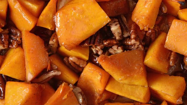 Overhead view of candied yams with walnuts