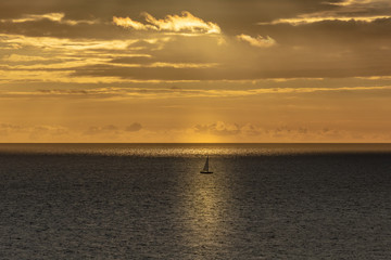 sunset on beach with boat