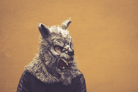 Person with wolf mask photograph