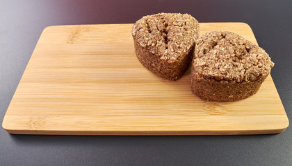 high-quality rye wheat bread on a chopping board made from a noble variety of Chinese bamboo. homebaked bread. healthy food. cook