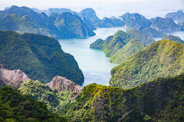 scenic view over Ha Long bay from Cat Ba island, Ha Long city in the background, UNESCO world heritage site, Vietnam