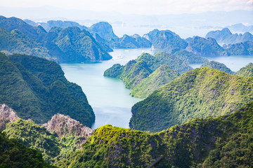 scenic view over Ha Long bay from Cat Ba island, Ha Long city in the background, UNESCO world heritage site, Vietnam