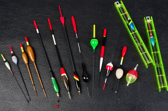 Fishing floats on a black background. Copy space