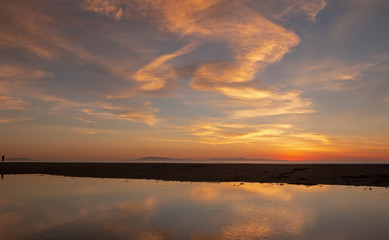Sunset cloud reflection over Santa Clara river seaside marsh at Ventura beach in California United States