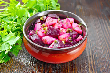 Obraz na płótnie Canvas Salad of beets and potatoes in bowl on table