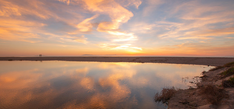 Sunset cloud reflection over Santa Clara river seaside wetland at Ventura beach in California United States