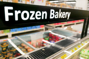 Frozen Bakery signage at the fresh refrigerated section supermarket
