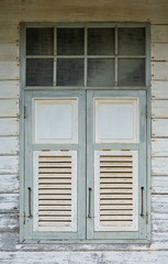 Detailed shoot of window in old house in Thailand. Thai wood house.