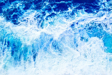 Defocused top view of storm sea