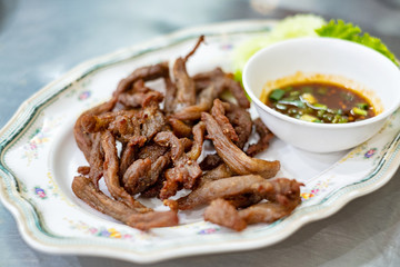 Dish of fried sun dried beef serving on table