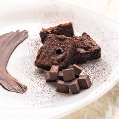 chocolate cake with whipped cream and chocolate brownie