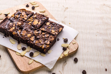 Obraz na płótnie Canvas chocolate cake with whipped cream and chocolate brownie