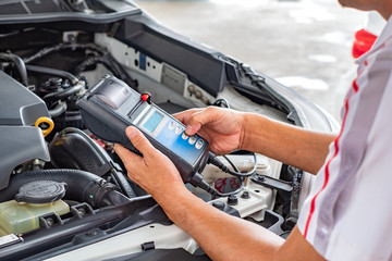 Fototapeta premium technician are conducting car check for car repair.