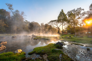 Fototapeta na wymiar Morning fog over hot spring at Chae Sorn National Park, Lampang, Thailand