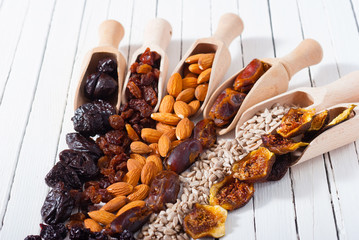 dried super foods on white wood table background