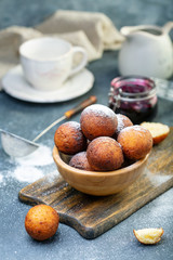 Cottage cheese donuts in a wooden bowl.