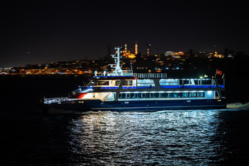 ferry moves on background of Suleymanie mosque