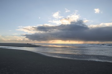 north sea beach with dramatic rain clouds