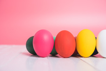 Easter eggs clean on wooden and pink background