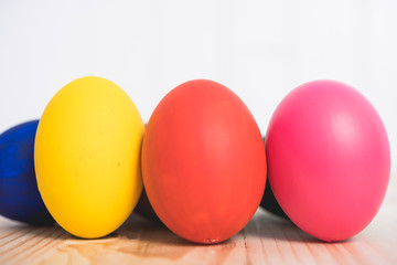 Easter eggs clean on wooden and white background