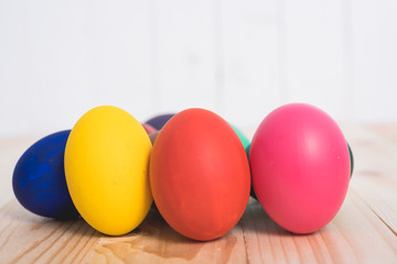 Fototapeta na wymiar Easter eggs clean on wooden and white background