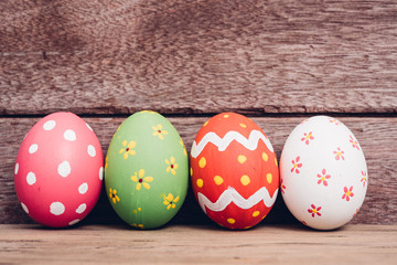 Beautiful Easter egg on wooden background