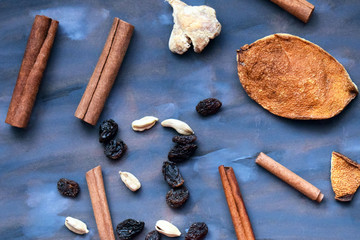 ingredients for making mulled wine. Cinnamon ginger and orange peel. Spices for baking.