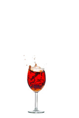 red wine pouring into wine glass isolated on a white background