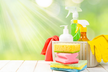 Spring cleaning concept - cleaning products, gloves, bokeh background, copy space