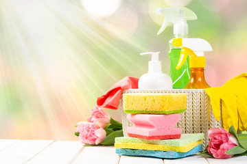 Spring cleaning concept - cleaning products, gloves, bokeh background, copy space