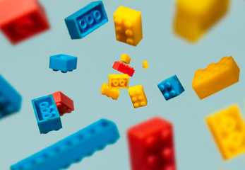 Floating Plastic geometric cubes in the air. Construction toys on geometric shapes falling down in...