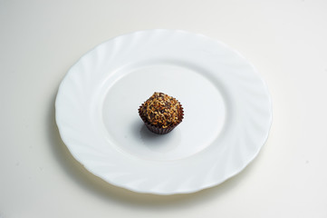 vegetarian candy ball with sesame seeds on a large white plate