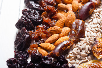 dried super foods on white wood table background