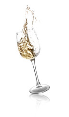 Glass with splashing wine on white background