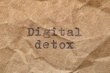 Digital detox words printed on paper.