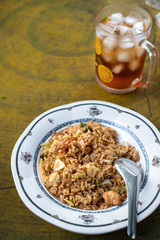 Thai seafoos fried rice with vegetablecorn with ice tae. Thai food menu and recipe.