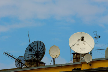 satellite dishes on the roof of the house