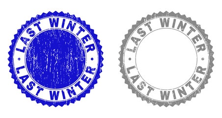 Grunge LAST WINTER stamp seals isolated on a white background. Rosette seals with grunge texture in blue and gray colors. Vector rubber stamp imitation of LAST WINTER title inside round rosette.