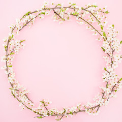 Plakat Floral frame with spring flowers on pastel background. Flat lay, top view. Spring time background.