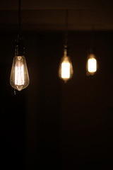 Lamps with tungsten filament. Edison's light bulb. Filament filament in vintage lamps. Retro design of light bulbs.