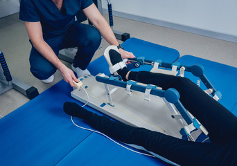 Patient on CPM (continuous passive range of motion) machines. Device to provide anatomically correct motion to both the ankle and subtalar joints.