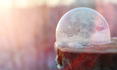 Soap bubbles freeze in the cold. Winter soapy water freezes in the air.