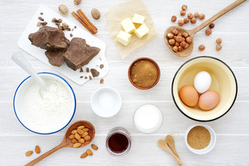 Ingredients for making chocolate baking on white wooden background