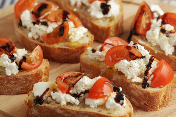 Sandwisches with tomatoes, homemade cheese. olive oil and balsamic souce