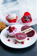 Valentines day desserts.Raw vegan mini cakes made with strawberries, cocoa butter, cashew and dates